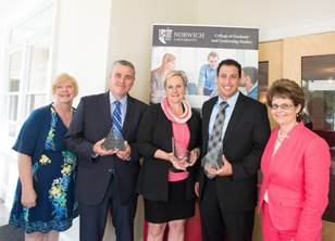 Representatives from National Life Group stand with Norwich University employees after receiving their Organization Participant Award from the 2014 Leadership Summit. Both Joyce B. LaRosa and Oran Blumenfeld from National Life are beginning their master's degrees at Norwich University with the $4,000 tuition waiver. Left to right: Shelley Brown (Norwich Director of Business and Partnership Development), William D. Whitsell (National Life Senior Vice President, Operations), Joyce B. LaRosa (National Life Vice President of Life and Annuity Finance), Oran Blumenfeld (National Life Second Vice President of New Business & Customer Relations), Stacie Morgan (Norwich Director, Master of Science in Leadership).