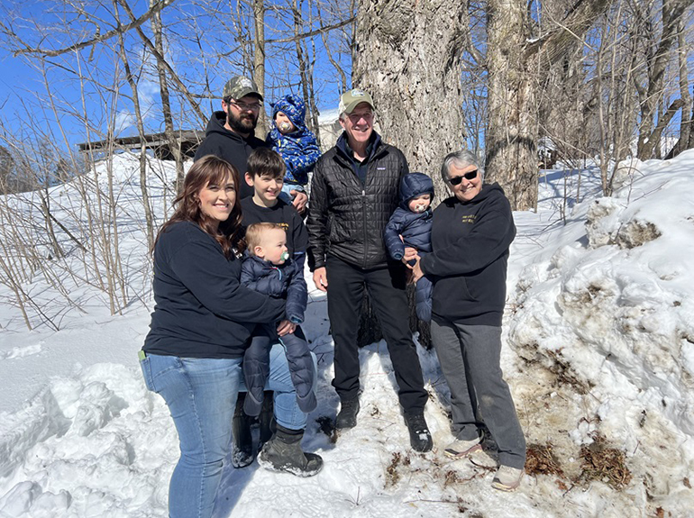 Photo: Governor joined the Solinsky family and Vermont Secretary of Agriculture Anson Tebbetts to tap a maple tree. Courtesy photo.