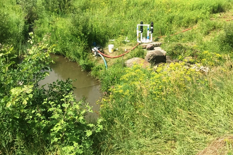 Pump withdrawing water from a small stream in Chittenden County. Vermont DEC photo.