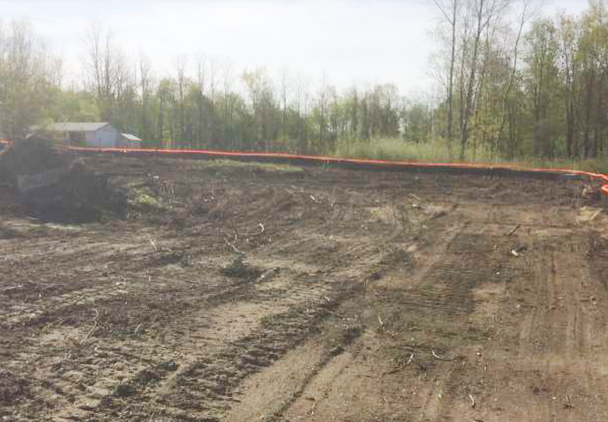 Barrier tape marks the limits of the construction site. 