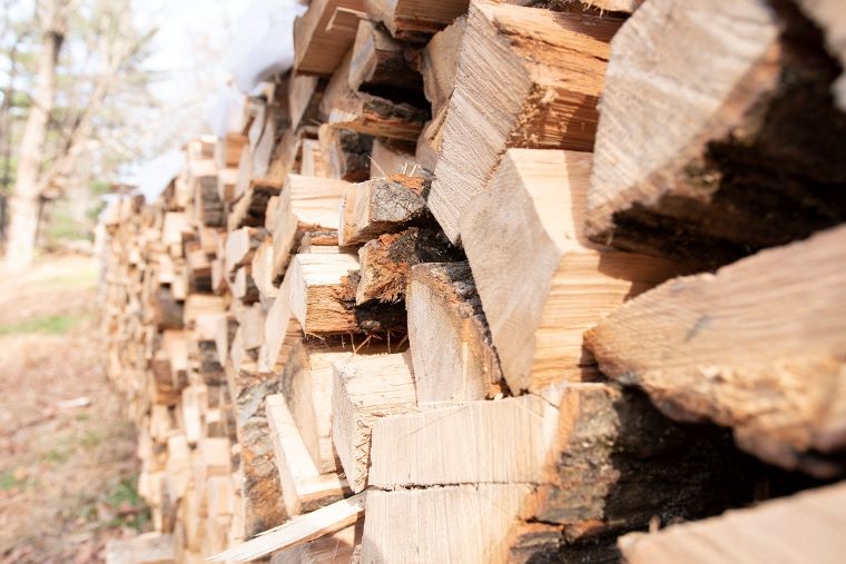 How to season firewood and cut costs, smoke, and fuel use. ANR photo.