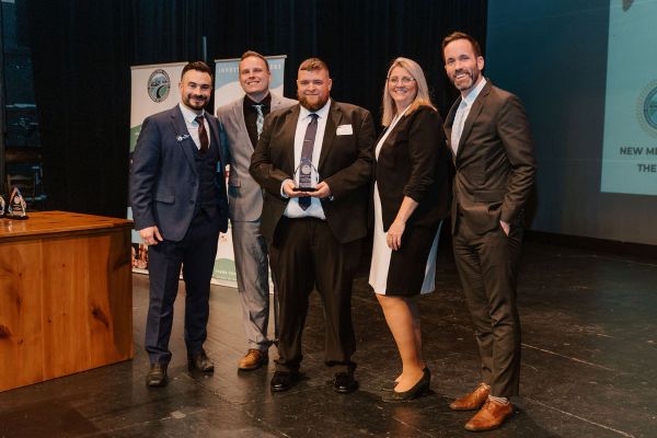 Nicholas Burchell, Joshua Willetts and Kevin Zalaznik of Hoffman Car Wash receive the Member of the Year award from the Chamber