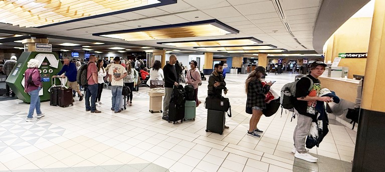 Incoming BTV passengers line up for a rental car on a busy Wednesday evening in early October. VermontBiz photo.