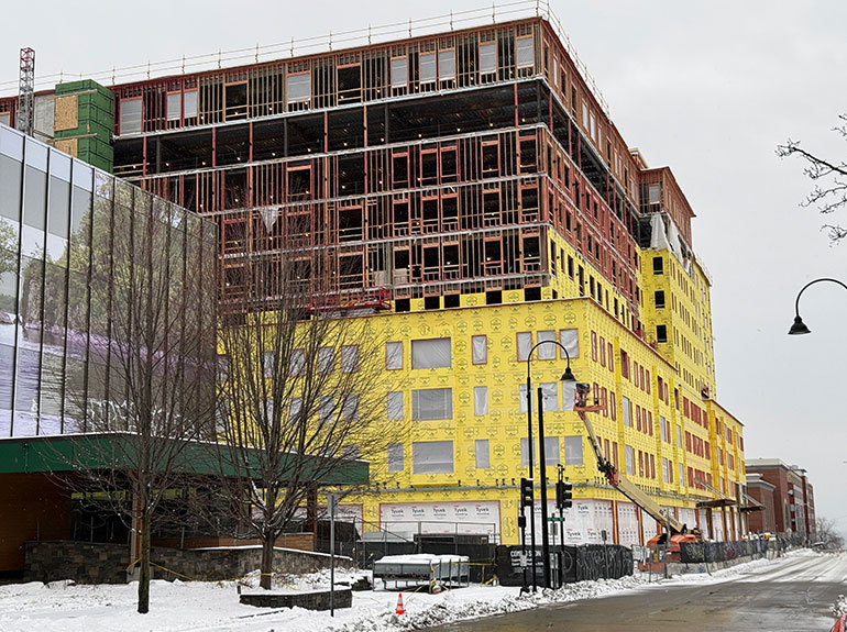 Photo: The north tower at Burlington Square  is well along in its  development, with an expected 2027  completion. The former LL Bean store is to the left and the former Macy’s  is at the far end. VermontBiz photo.