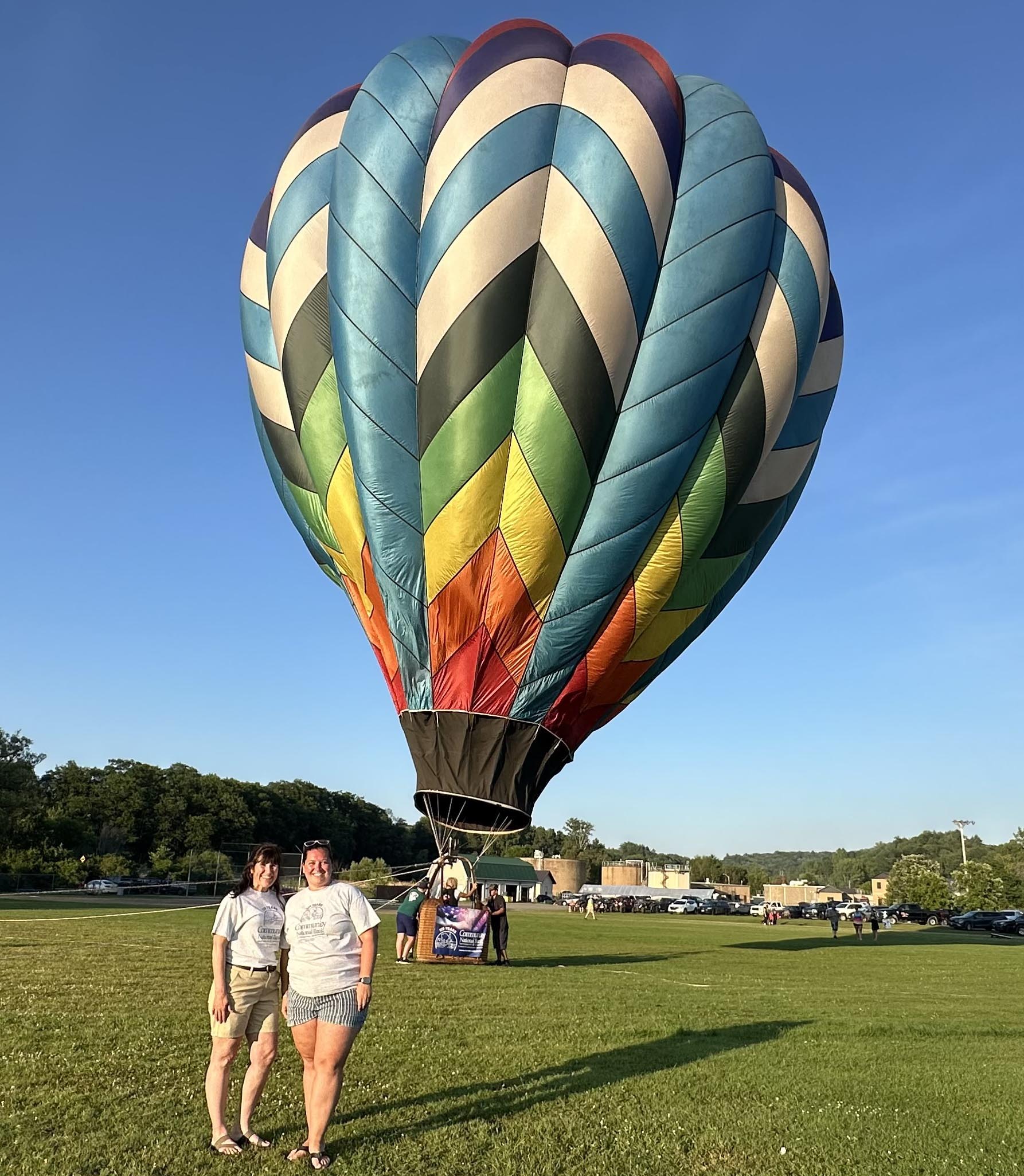 Balloon pilots and Community National Bank donate to NEKCA Food Shelf