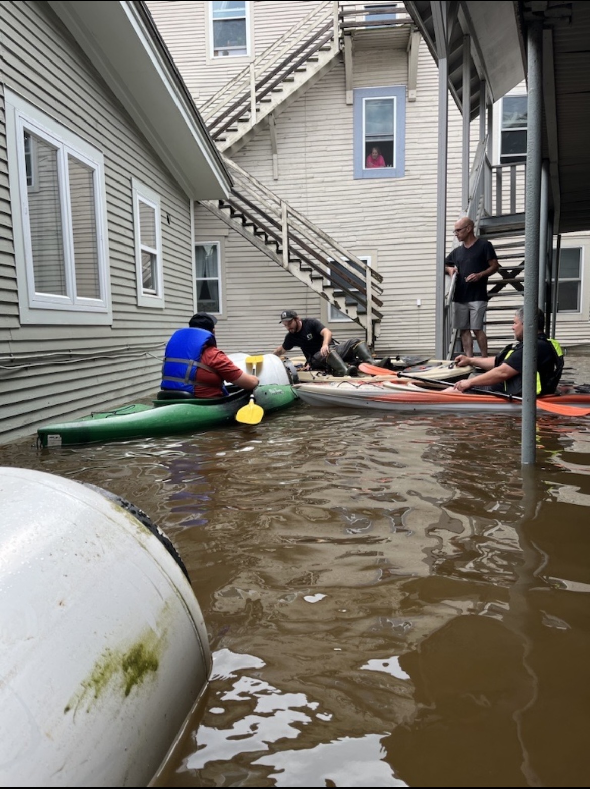 Bourne's employees capture and secure propane tanks during the July 2023 flood. 