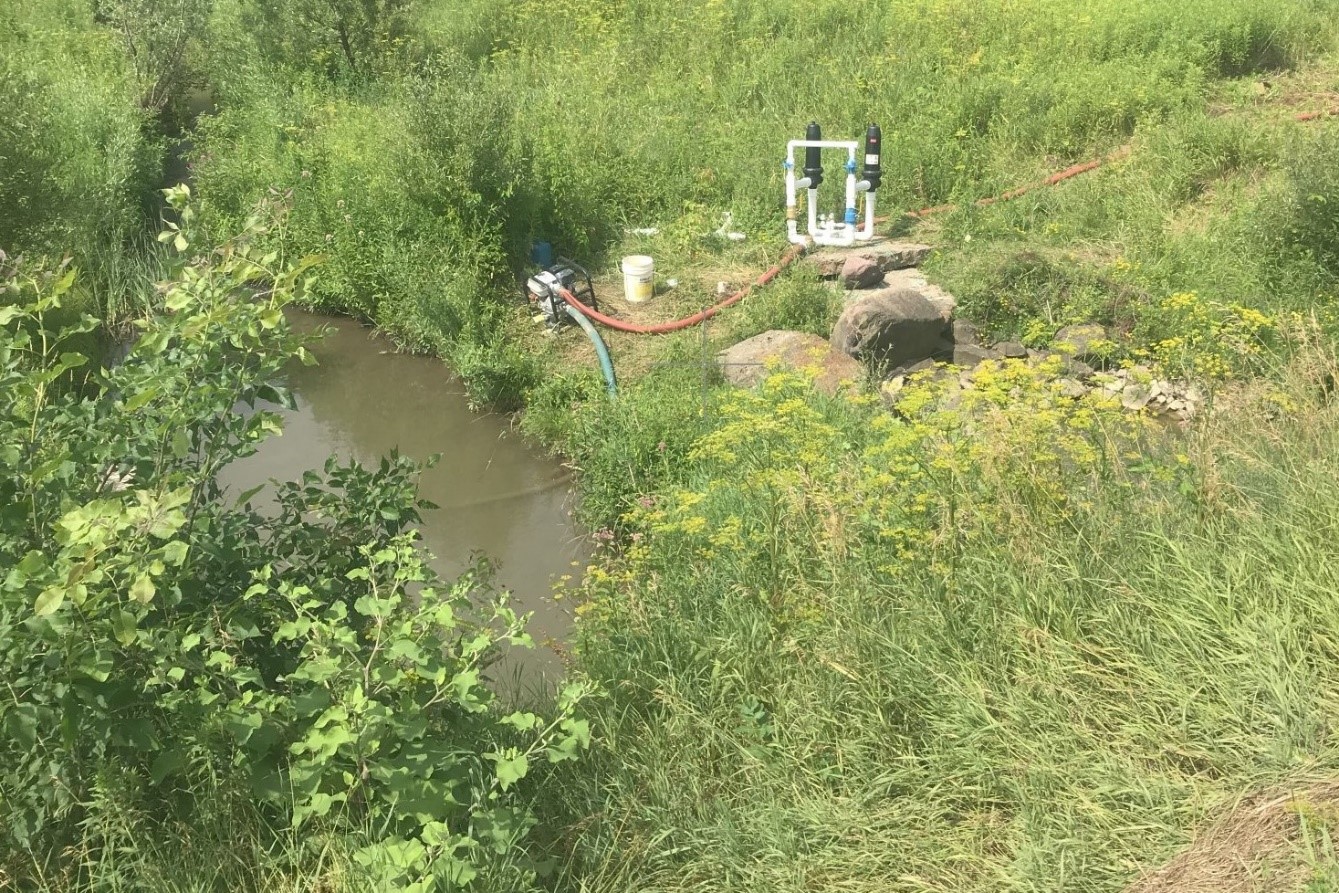 Pump withdrawing water from a small stream in Chittenden County. DEC photo.
