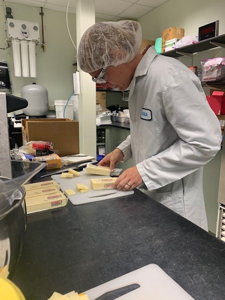 Photo: Gina Accorsi, Cheese Grader, performs a 30-day shelf-life evaluation where sensory attributes are evaluated to assure the packaging does not impact cheese quality. Cabot photo.