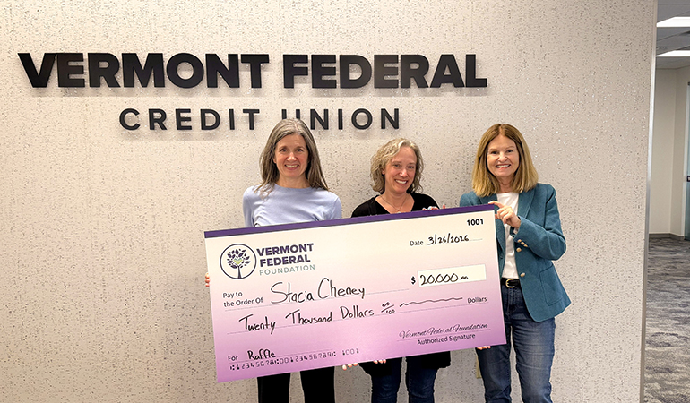 Photo: Stacia Cheney receives her check. Courtesy photo.