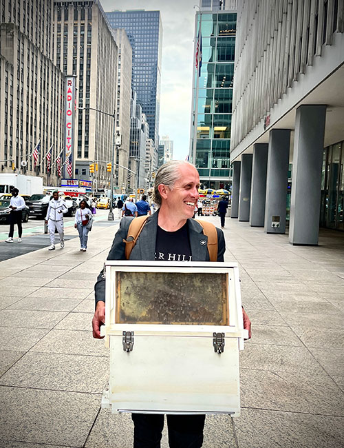 Photo: Ryan Chritiansen in New York City with bees. Photo courtesy Caledonia Spirits.