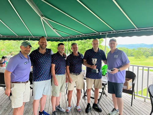 Photo: The winning team, Kimpton Taconic, hold the B2B Cup with Matt Harrington, executive director of the Southwestern Vermont Chamber (left) and John Burnham of the Manchester Business Association (right). Courtesy photo.