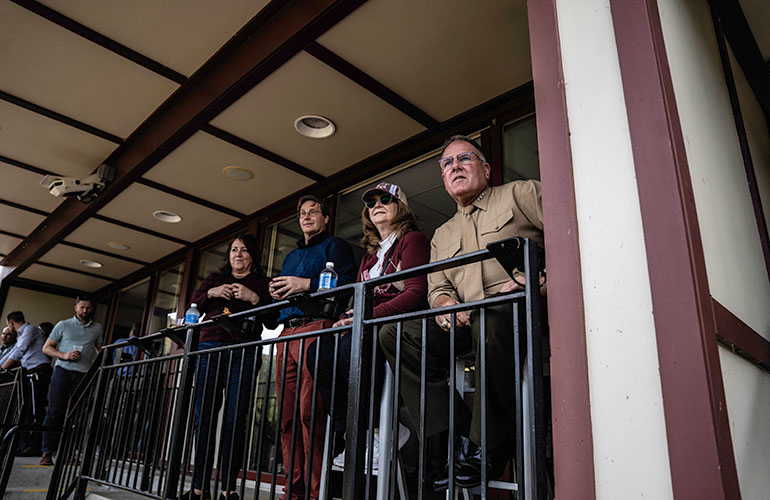 Photo: LtGen Broadmeadow (R), Mrs. Broadmeadow enjoy the game with guests. Courtesy photo.