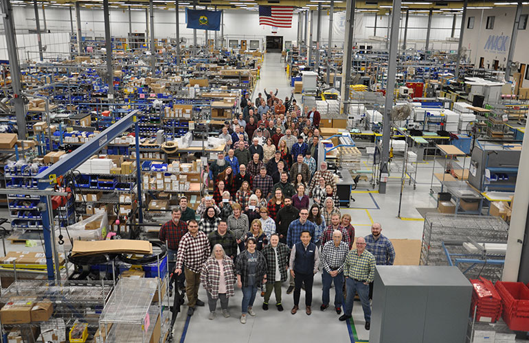 Photo: Mack Molding team members at the company’s headquarters in Arlington take part in Flannel Friday, one of several engagement activities held across the company’s three Vermont facilities. Courtesy photo.