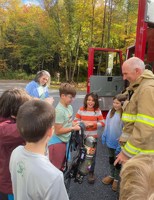 Photo: Local firefighters and Red Fox parents, Nick Parks and Leslie Bledsoe, to teach students essential fire safety skills. Courtesy photos.