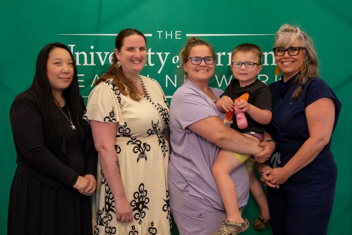 UVM Medical Center nursing graduates Xi Chen, LPN, Jen Grandfield, LPN, Rochelle McDonald, RN, and her son, Bo, and Jennifer Valyou-Hopkins, RN, are pictured at the Nursing Pathway Program’s graduation event in May.