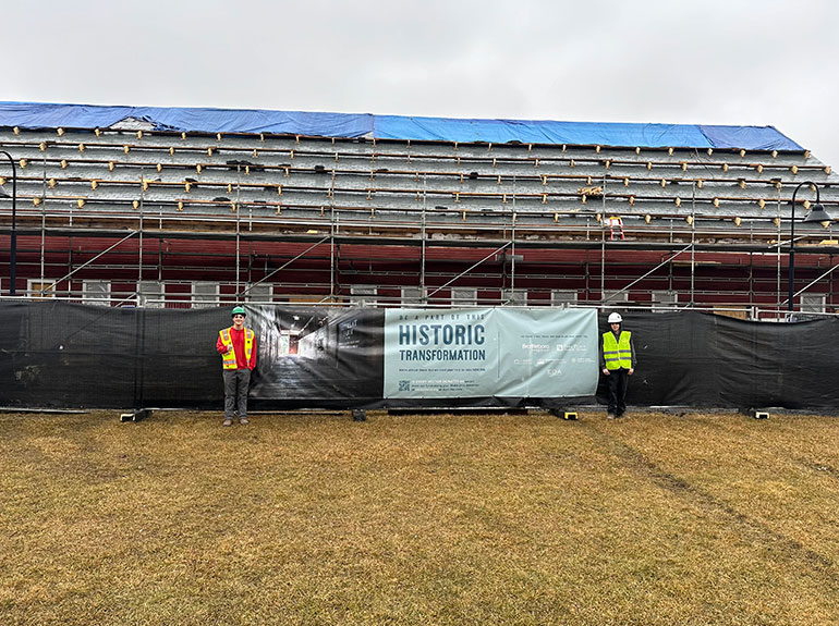 Photo: Randolph Technical Career Center students Kellan Ballou, a senior in the Electrical Trades Program, and Peyton Johnson, a senior in the Construction Trades Management Program visit the Retreat Farm project in Brattleboro. Photo courtesy DEW Construction.