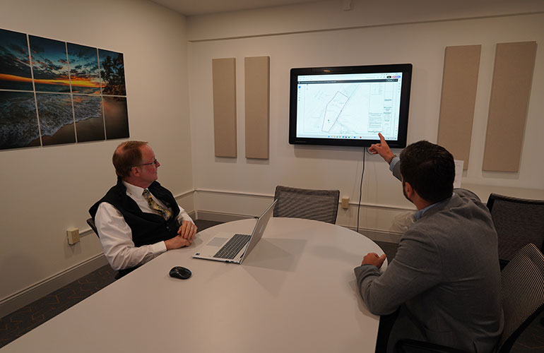 Photo: Photo: Lyle Jepson, left, executive director at the Chamber & Economic Development of the Rutland Region, and Devon Neary, executive director at the Rutland Regional Planning Commission, discuss development plans.  Photo courtesy to CEDRR.