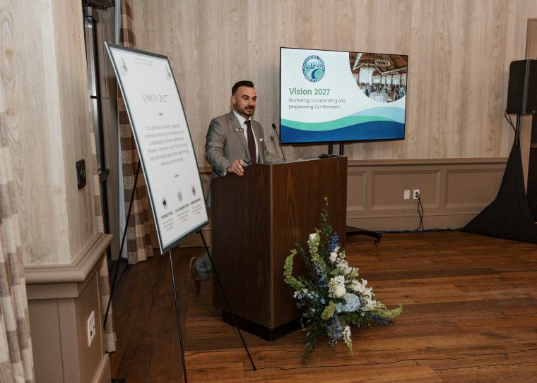 Pictured: Matt Harrington, executive director of the Chamber, overseeing his tenth annual membership meeting