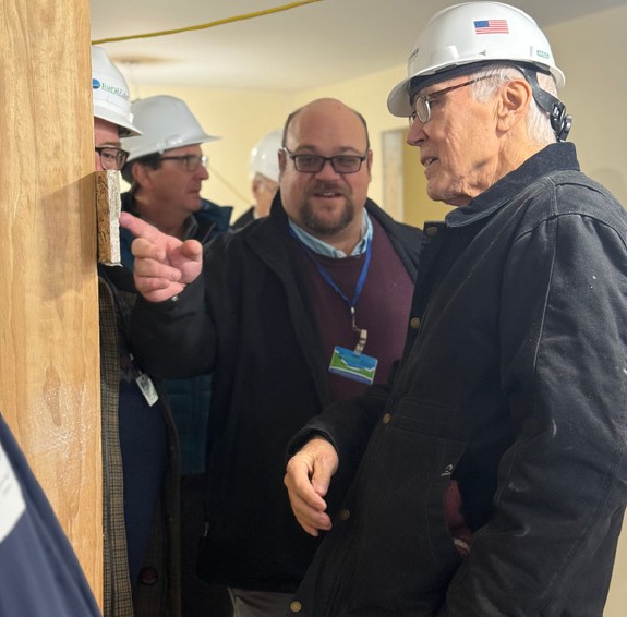 RuralEdge Executive Director Patrick Shattuck explains Newport Crossing historic conservation features to VT State Rep. Scott Campbell. 