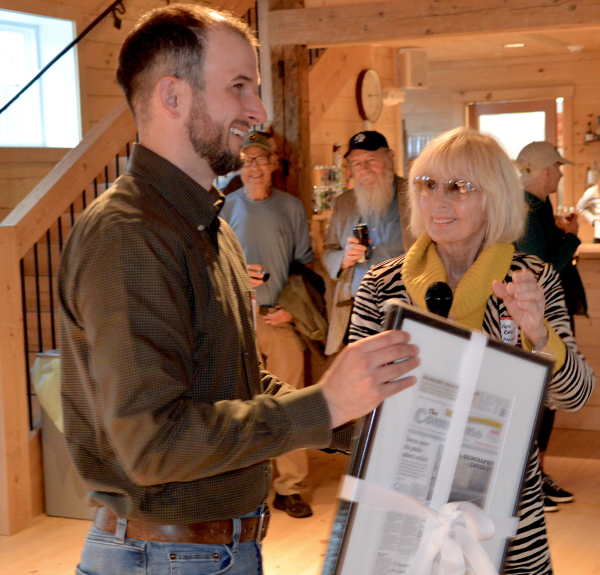 Robert Davis, Senior VP BS&L accepts Community Partner Award from Lynn Barrett, president of the Board, VIM/The Commons