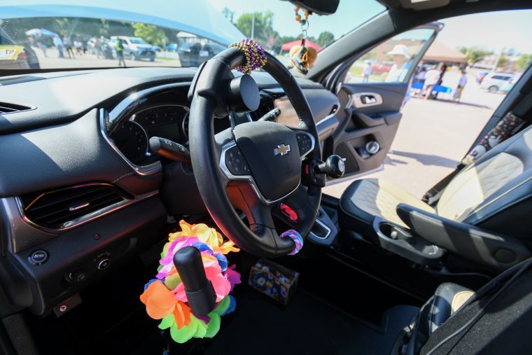 The interior of a Chevrolet truck modified with adaptive steering controls was among more than a dozen vehicles on display Saturday