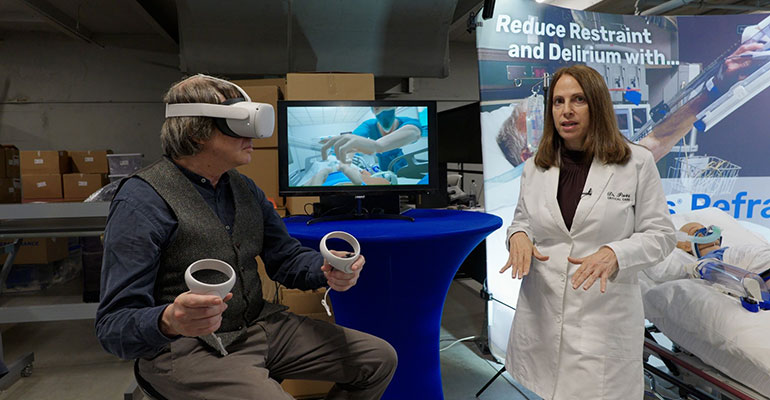 Photo: Dr. Pavini demonstrates the company’s virtual realty app with COO Stephen Flint. Courtesy photo.