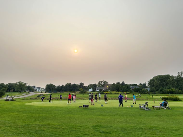 Smoky sunset at the Kwini Club in Shelburne Thursday. New England state air quality forecasters are predicting elevated concentrations of fine particle air pollution due to wildfires in Quebec and Western Canada.