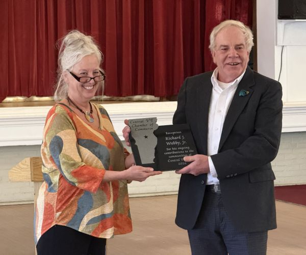 Jeannette Kingsbury, President of the Central Vermont Chamber of Commerce, present the Citizen of the Year award to AGC Vermont Executive VP Richard Wobby.