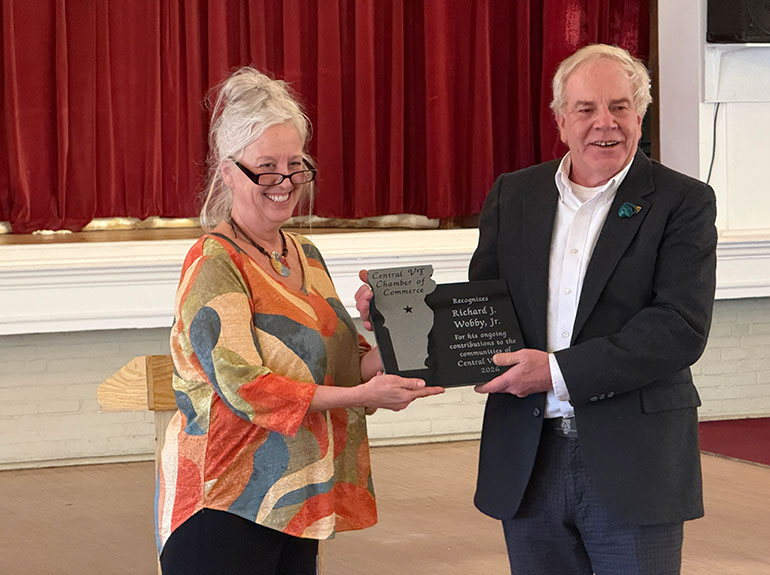 Photo: Jeannette Kingsbury, President of the Central Vermont Chamber of Commerce, present the Citizen of the Year award to AGC Vermont Executive VP Richard Wobby on Tuesday at the Elks Lodge in Barre. VermontBiz photo.