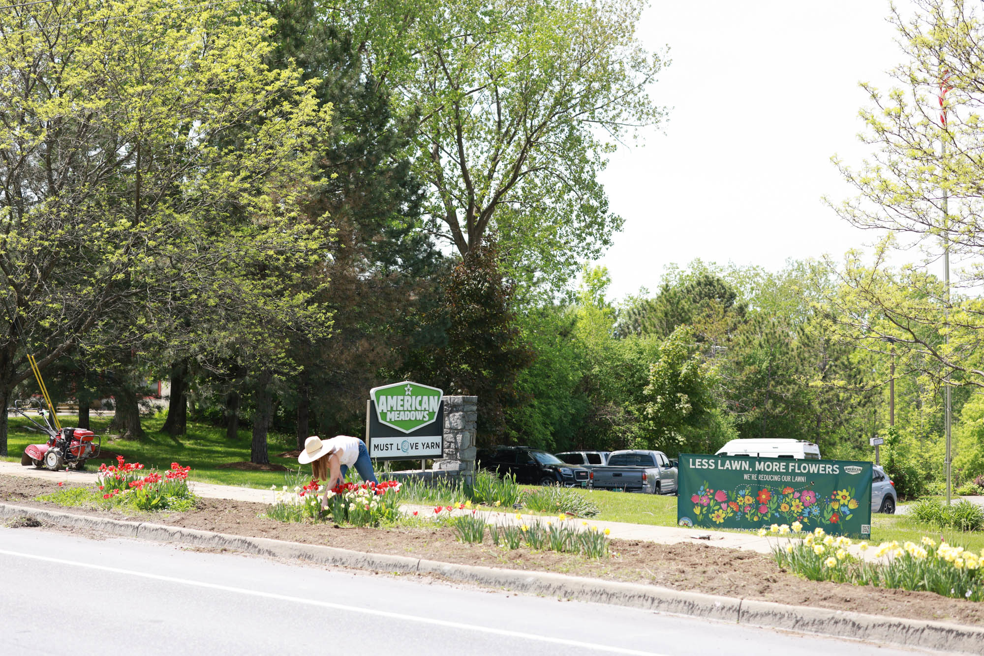Outside American Meadows HQ this spring, a Reduce Your Lawn Day banner waves along a busy road as the team begins transforming underutilized turf into thriving pollinator habitat