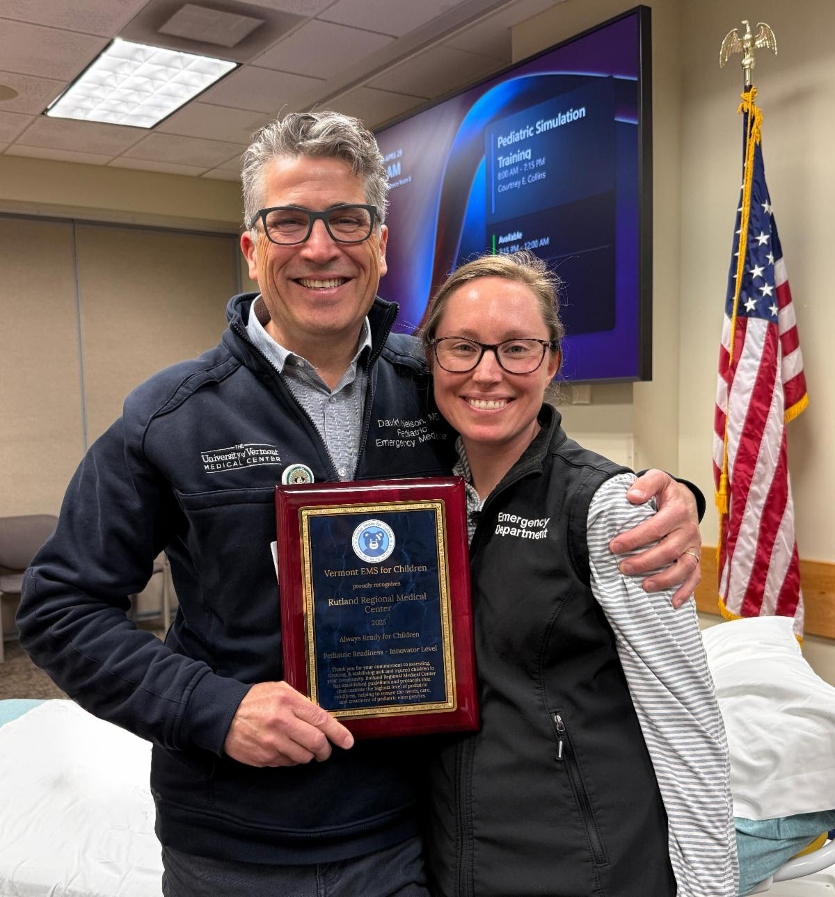 Dr. David Nelson, pediatric emergency physician at UVMMC and an educator for the Pediatric Readiness Program, presents Courtney Collins, Clinical Educator for the Emergency Department at RRMC