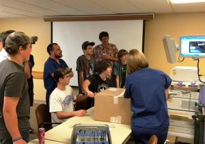 “School of Tech” students learning how to  operate an endoscopic surgical device at   Gifford Medical Center in Randolph, VT.