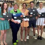 Students lined up with scholarships.