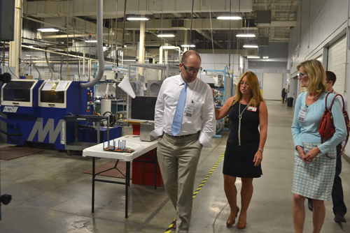 Monica Greene, center, provides a tour of Vermont Precision Tools to Seth Goodall, Small Business Administration New England Administrator, and Darcy Carter, SBA Vermont District Director, in August. VPT is a woman-owned manufacturing company with more than 300 employees. Greene, President and CEO of VPT, was named the 2015 Vermont Small Business Person of the Year. (photo by Danny Monahan)